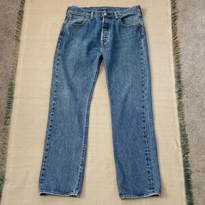 Levi's 501 Original Fit men's jeans, blue denim medium wash with a button fly.